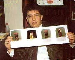 Angel Gordon displaying pictures of the Gnome of Gerona remains. (Image credit/source here.)